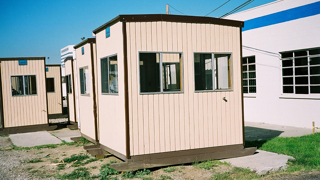 Row of prefabricated guard booths installed at a municipal operations facility